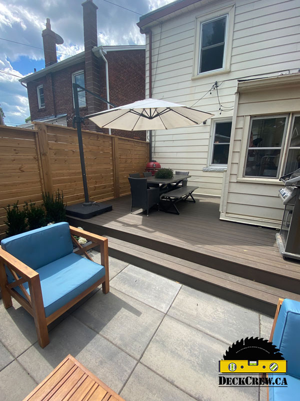 Composite deck with a grill and a dining area