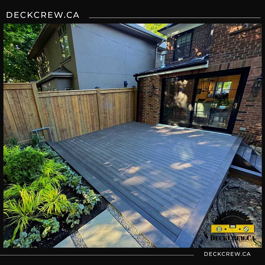 Backyard deck made from grey composite lumber