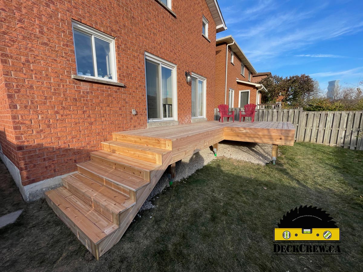 Cedar deck with wide stairs and helical pile foundation built in Mississauga