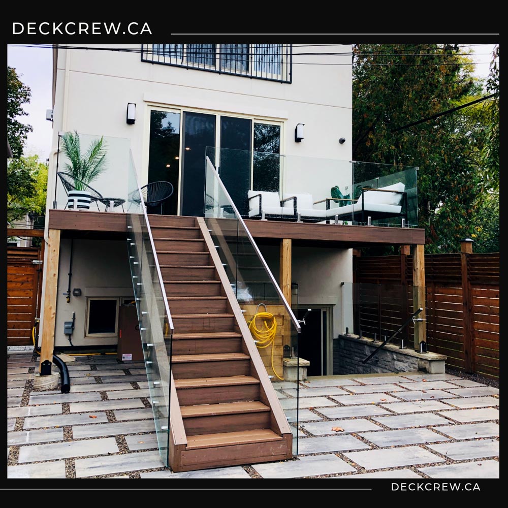 Second Story PVC Deck with Frameless Glass Railings – Toronto Second story PVC deck in Toronto with frameless glass railings and custom stairs
