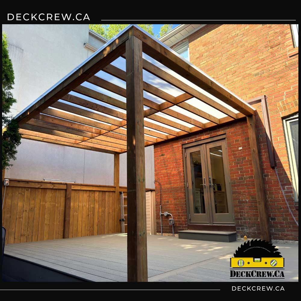Composite Deck with Pergola and Plastic Roofing – Toronto Composite deck with cedar pergola and clear polycarbonate roof built in Toronto
