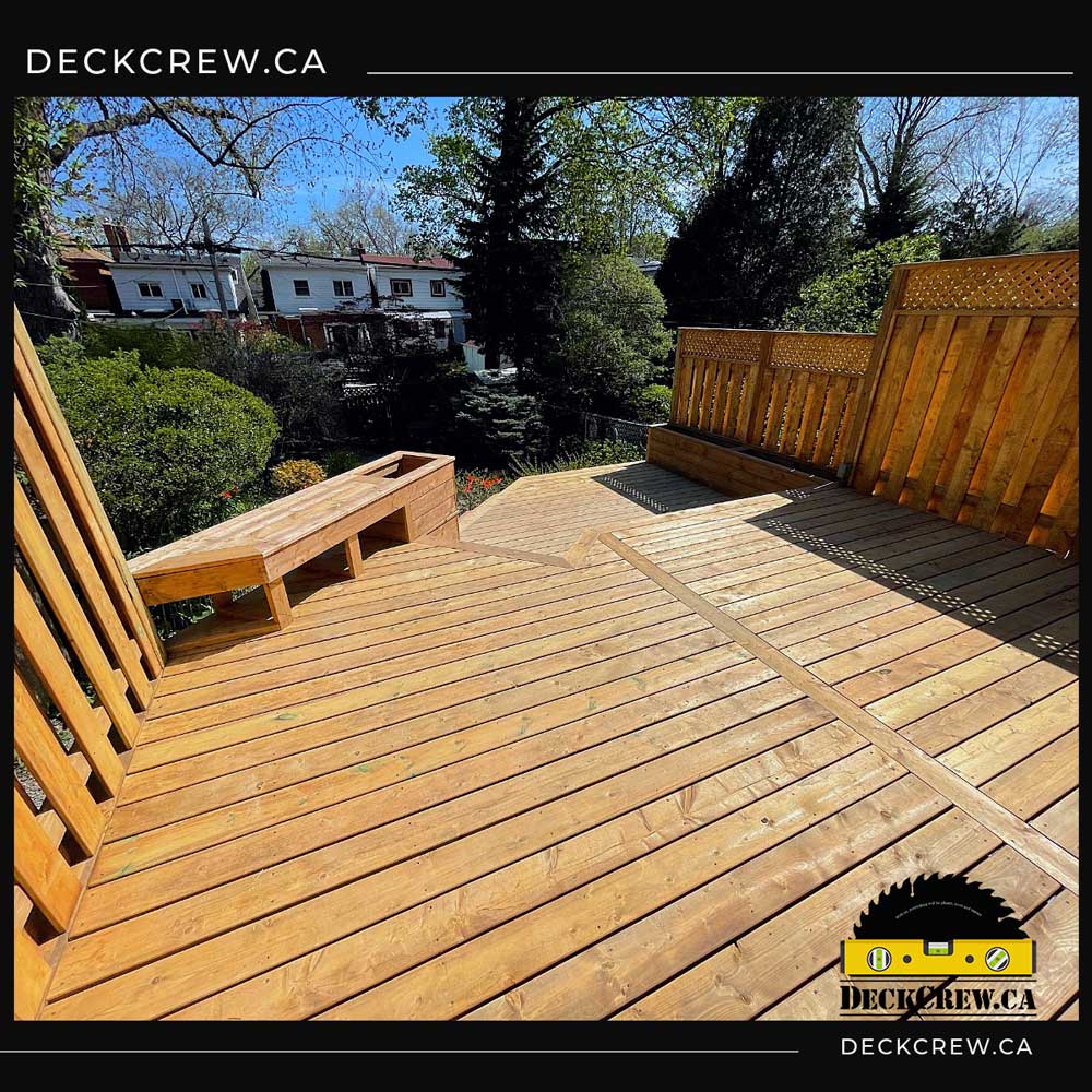 Two-Level PT Lumber Deck with Privacy Screens – Toronto Two-level pressure-treated lumber deck with built-in bench, planters, and privacy screens built in Toronto