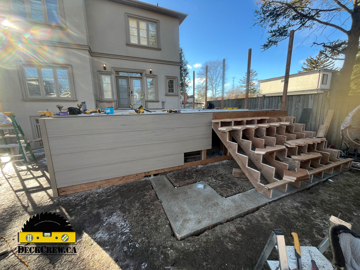 Composite deck construction in Lakeview Mississauga showing framed stairs and deck structure by DeckCrew