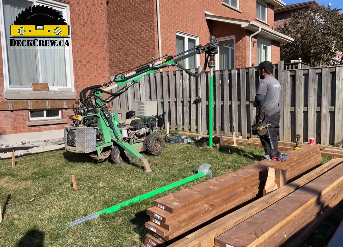 Helical Pile Installation for Cedar Deck in Mississauga Installing helical piles for a cedar deck project in Mississauga using professional pile installation equipment.